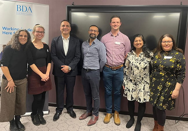 Networking with peers Participants at a BDA branch event smiling towards the camera