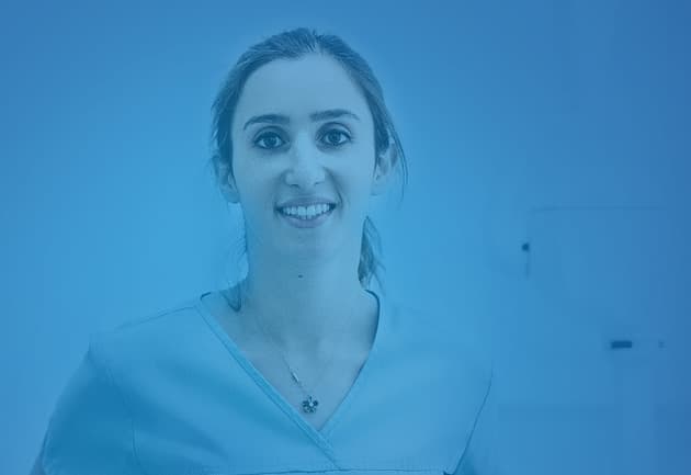 Associateships Web Appetiser Ad 630X433px A female dentist wearing scrubs smiling into the camera