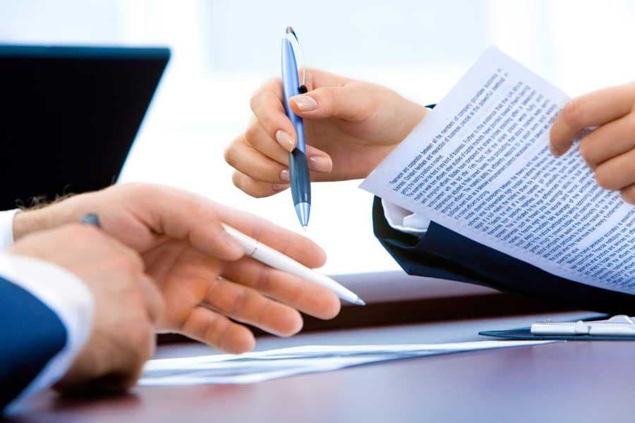 Understanding associate agreements A contract being signed