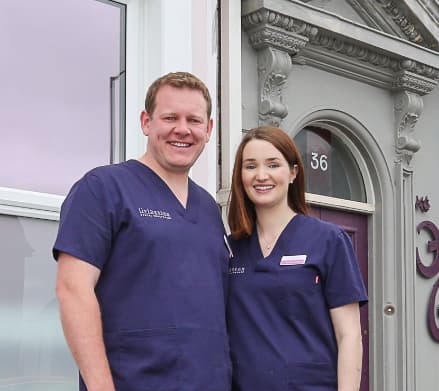 The Livingstones Ross and Jenny Livingstone stand together outside their practice