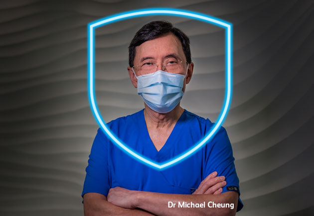 Indemnity ad - Dr Michael Cheung Dr Michael Cheung wearing scrubs and a facemask looking confidently into the camera