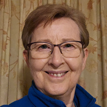 A close up of Linda Dunlop smiling towards the camera