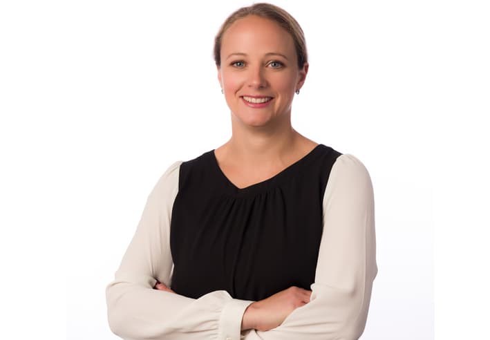 NHS And Business Team Ad Victoria Michell, Head of the NHS and Business team, smiling confidently towards the camera